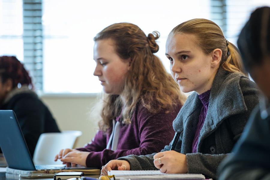 Students sitting at desks in a classroom